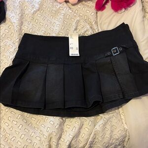 Black Pleated Mini Skirt with Buckle Detail